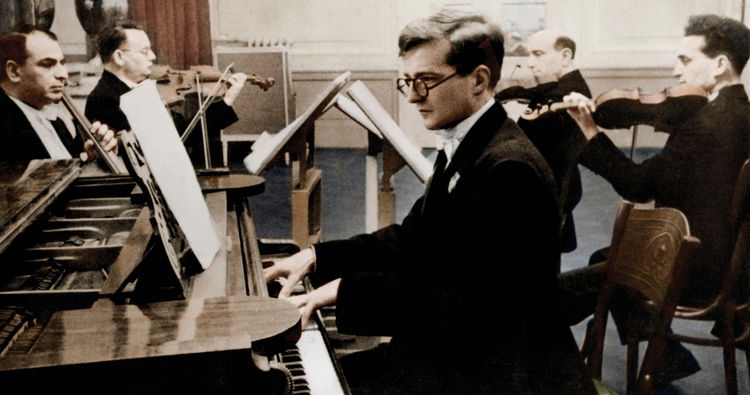 Photo of Dmitri Shostakovich by the piano.